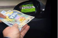 Ofițer SRI prins în flagrant, în timp ce primea mită 2.500 de euro
